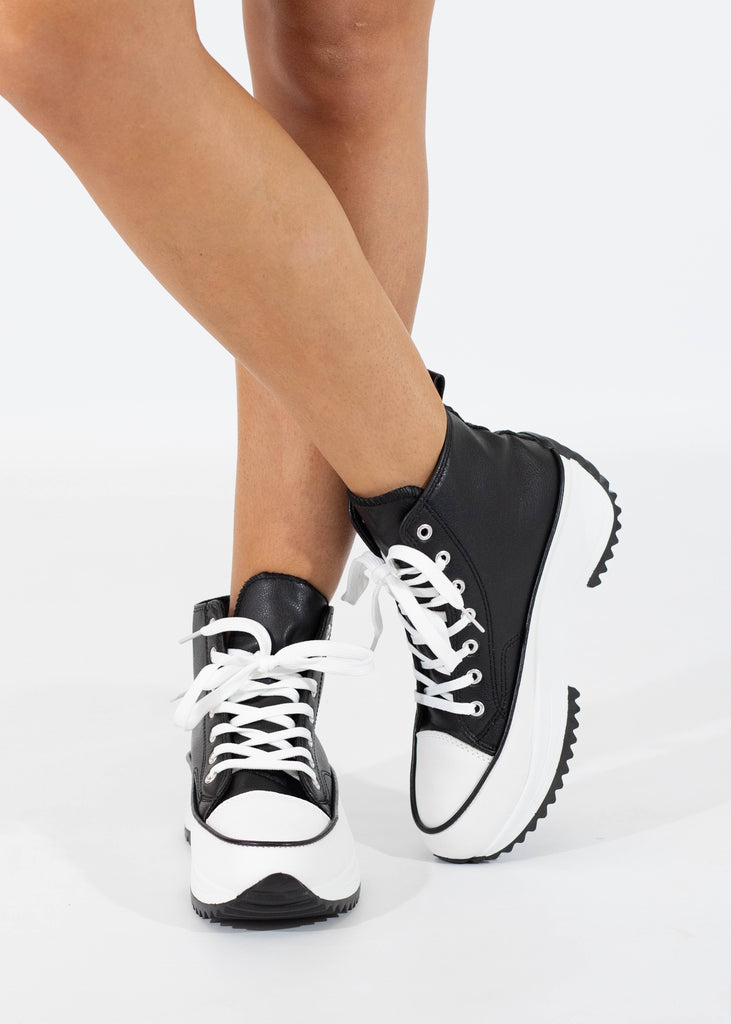 black high top sneaker with platform sole