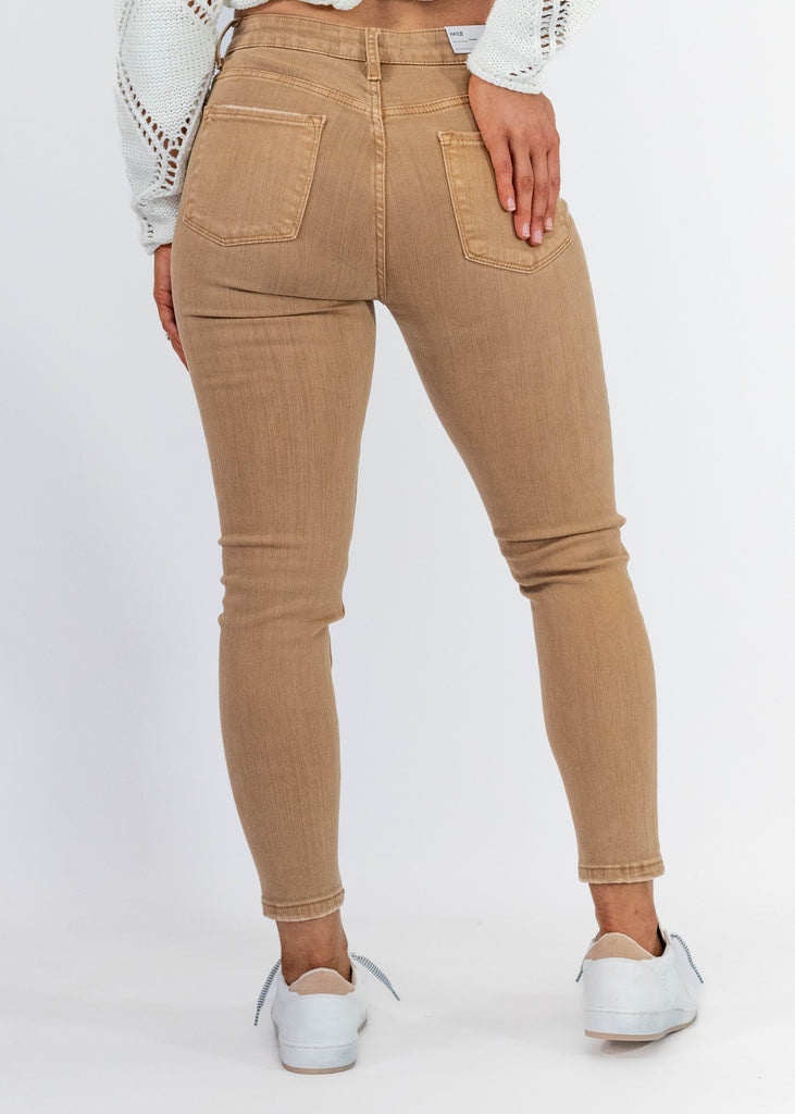 tan ankle length high rise skinny jeans with light distressing