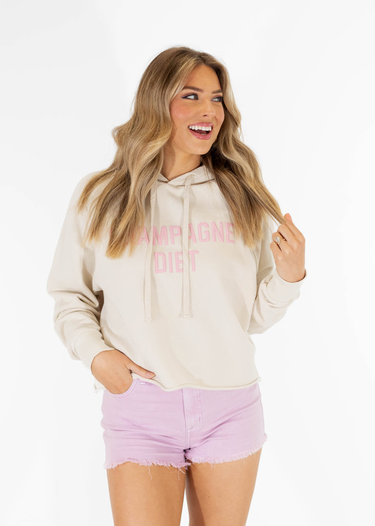 beige cropped hoodie with pink "Champagne Diet" print