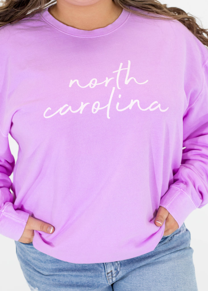 purple sweatshirt with white "north carolina" print