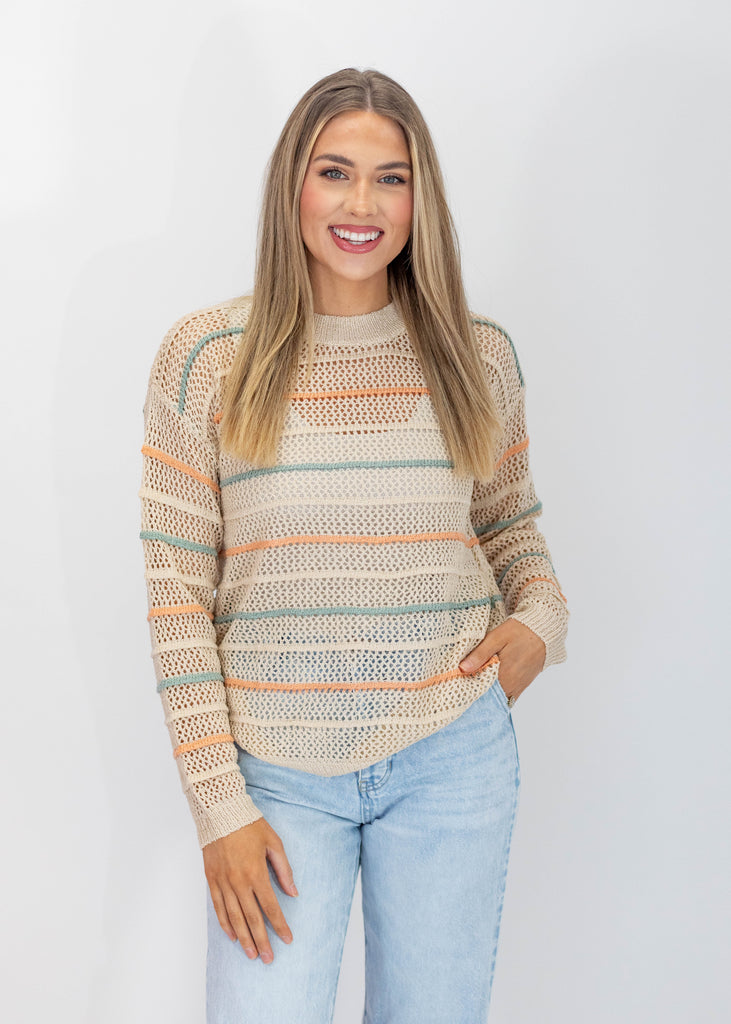 long sleeves, cream with teal and orange horizontal stripes, knitted